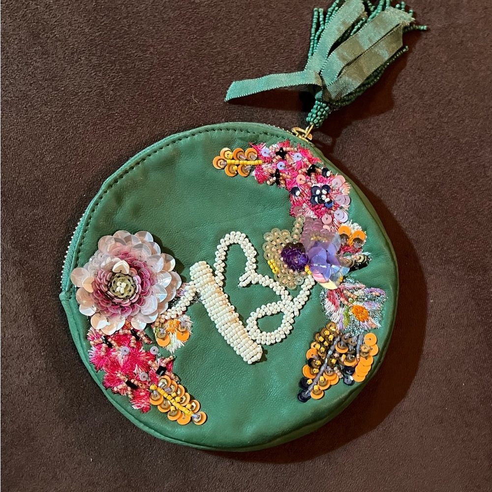 Anthropologie small beaded tassel bag. New without tags. 100% leather